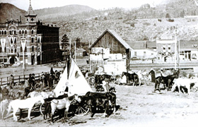 Historical Image of Exterior with Horses in Foreground The Strater Hotel Durango Colorado